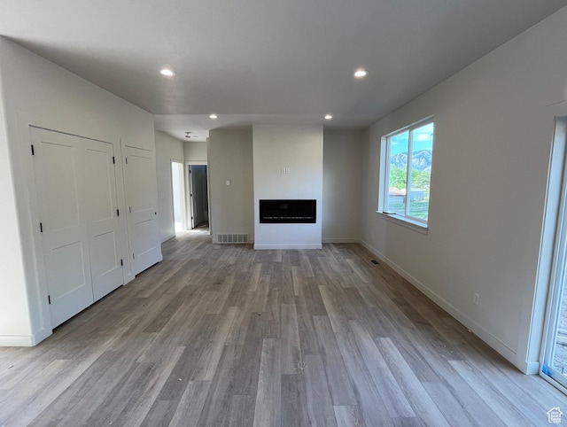 4068 Porter Ave, South Ogden, UT 84403 - unfurnished living room featuring wood finished floors, recessed lighting, a fireplace, and baseboards