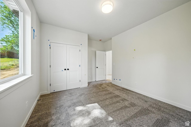4068 S Porter Ave, South Ogden, UT 84403 - unfurnished bedroom featuring carpet, multiple windows, and a closet