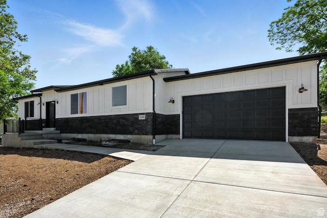 4068 S Porter Ave, South Ogden, UT 84403 - view of front of house featuring driveway, board and batten siding, and an attached garage