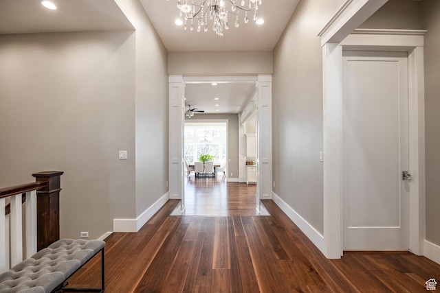 884 E Fence Post Rd S, Fruit Heights, UT 84037 - hallway with baseboards, dark wood-style flooring, and a notable chandelier