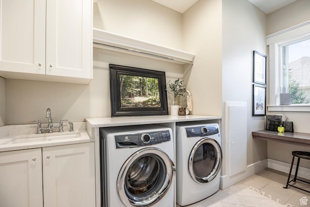 884 E Fence Post Rd S, Fruit Heights, UT 84037 - clothes washing area with washer and clothes dryer, light tile patterned floors, cabinet space, a sink, and baseboards