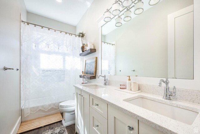 884 E Fence Post Rd S, Fruit Heights, UT 84037 - bathroom with toilet, double vanity, shower / bathtub combination with curtain, and wood finished floors