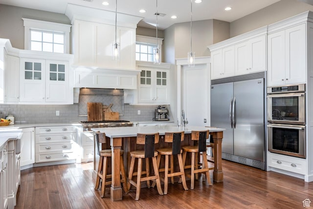 884 E Fence Post Rd S, Fruit Heights, UT 84037 - kitchen with backsplash, dark wood-type flooring, stainless steel appliances, and light countertops