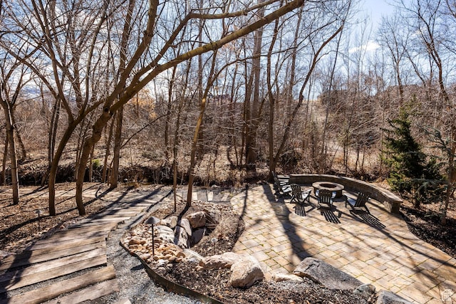 884 E Fence Post Rd S, Fruit Heights, UT 84037 - exterior space featuring an outdoor fire pit and a wooded view