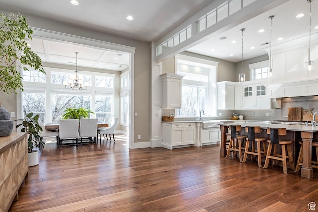 884 E Fence Post Rd S, Fruit Heights, UT 84037 - kitchen with dark wood-style flooring, light countertops, and decorative backsplash