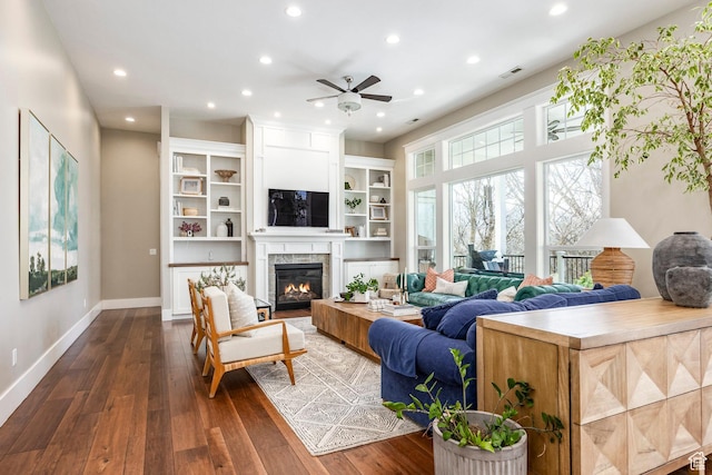 884 E Fence Post Rd S, Fruit Heights, UT 84037 - living area with recessed lighting, dark wood-style flooring, visible vents, baseboards, and a glass covered fireplace