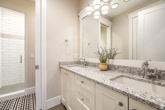 884 E Fence Post Rd S, Fruit Heights, UT 84037 - full bathroom featuring baseboards, double vanity, a sink, and a shower stall