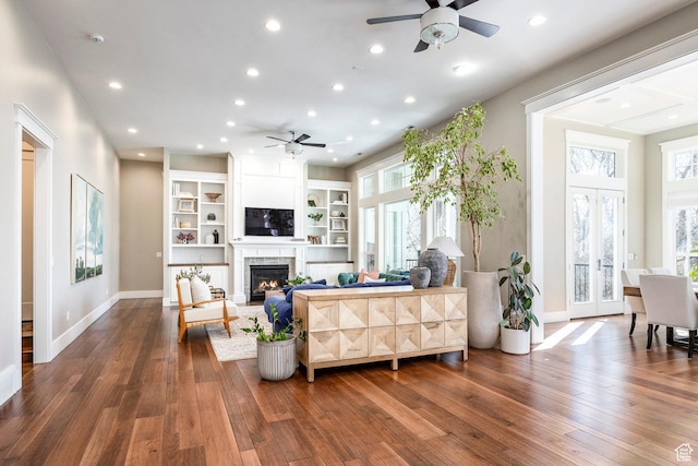 884 E Fence Post Rd S, Fruit Heights, UT 84037 - living area with hardwood / wood-style flooring, recessed lighting, a high end fireplace, baseboards, and french doors