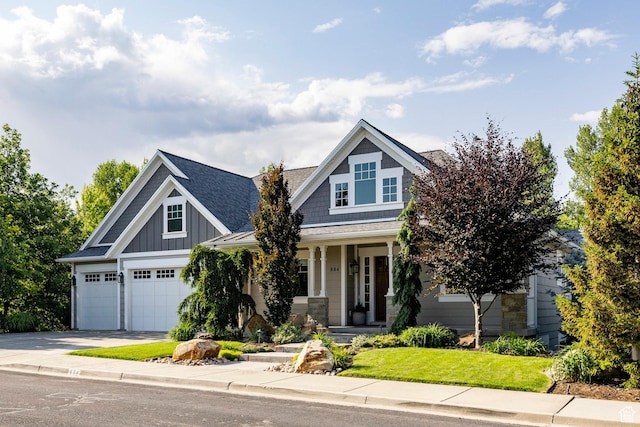 884 E Fence Post Rd S, Fruit Heights, UT 84037 - craftsman inspired home featuring driveway, a porch, board and batten siding, a shingled roof, and a front lawn