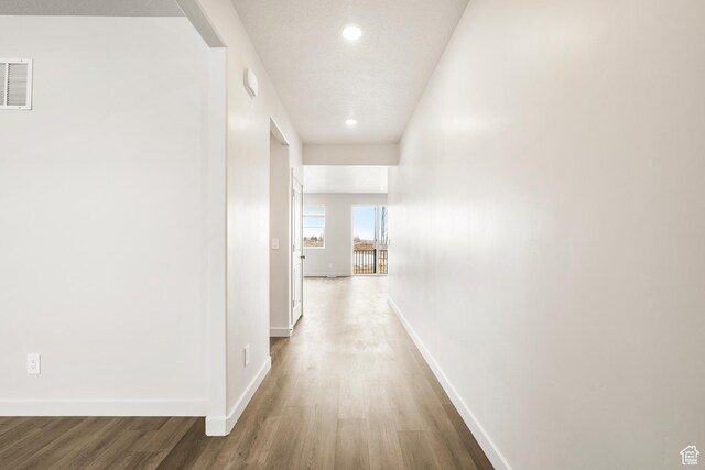 3537 S 3150 W Unit 106, West Haven, UT 84401 - hallway with baseboards, visible vents, wood finished floors, and recessed lighting