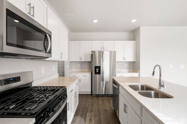 3537 S 3150 W Unit 106, West Haven, UT 84401 - kitchen with recessed lighting, dark wood finished floors, appliances with stainless steel finishes, white cabinetry, and a sink