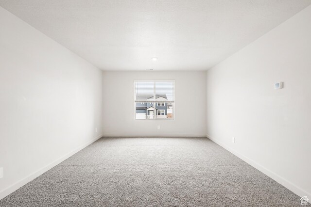 3537 S 3150 W Unit 106, West Haven, UT 84401 - empty room featuring baseboards and light carpet