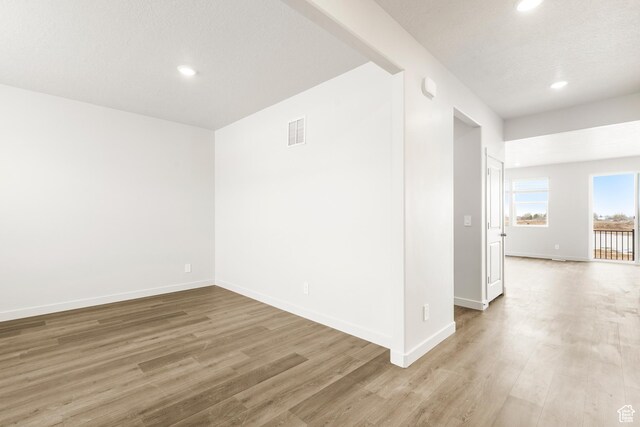 3537 S 3150 W Unit 106, West Haven, UT 84401 - unfurnished room featuring recessed lighting, baseboards, light wood-style floors, and visible vents