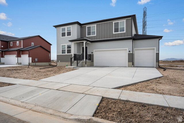 3537 S 3150 W Unit 106, West Haven, UT 84401 - traditional-style home featuring an attached garage, board and batten siding, and concrete driveway