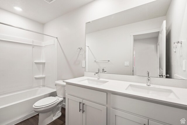 3537 S 3150 W Unit 106, West Haven, UT 84401 - full bathroom featuring double vanity, wood finished floors, toilet, and a sink