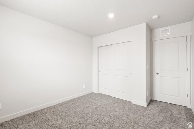 3537 S 3150 W Unit 106, West Haven, UT 84401 - unfurnished bedroom featuring carpet flooring, a closet, baseboards, and visible vents