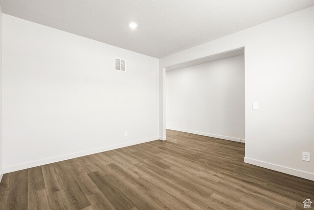 3537 S 3150 W Unit 106, West Haven, UT 84401 - spare room with baseboards, visible vents, recessed lighting, and dark wood-type flooring