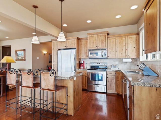 kitchen with appliances with stainless steel finishes, light brown cabinets, dark wood finished floors, and tasteful backsplash