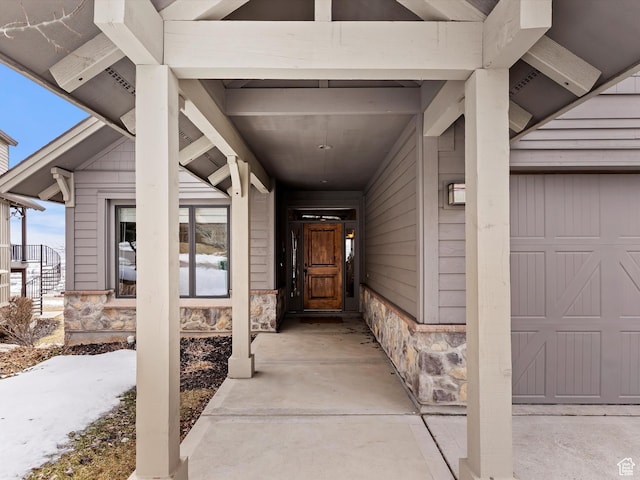 entrance to property featuring stone siding