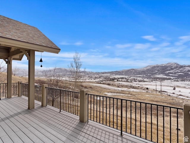wooden terrace featuring a mountain view