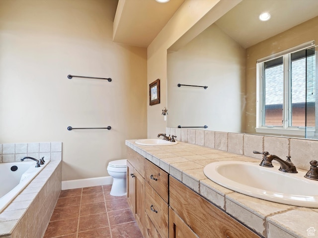 full bathroom with tile patterned flooring, a garden tub, a sink, and toilet