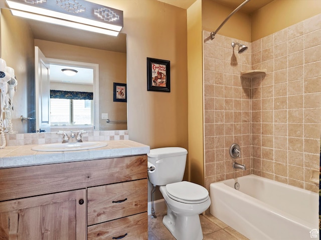full bath with toilet, tile patterned flooring, shower / washtub combination, and vanity