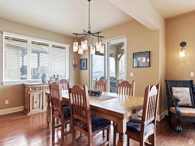 dining space featuring light wood-type flooring and baseboards