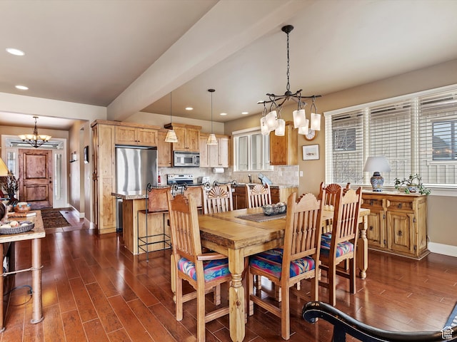dining space featuring recessed lighting, dark wood finished floors, baseboards, and an inviting chandelier