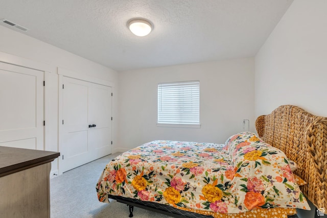 903 E 200 S, Pleasant Grove, UT 84062 - bedroom with a closet, visible vents, a textured ceiling, and light colored carpet