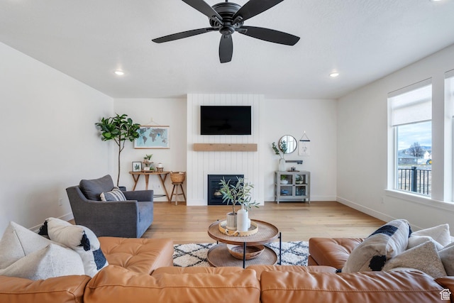 903 E 200 S, Pleasant Grove, UT 84062 - living room featuring recessed lighting, a large fireplace, baseboards, and wood finished floors