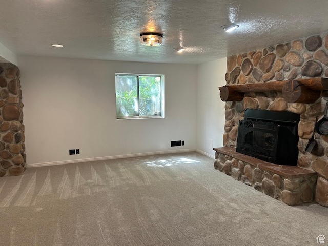 829 E 1925 N, North Ogden, UT 84414 - living room with carpet flooring, a fireplace, a textured ceiling, and baseboards