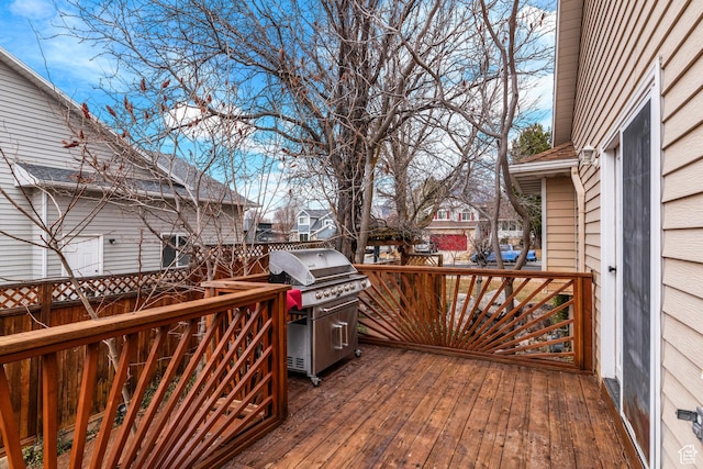 wooden terrace featuring a grill