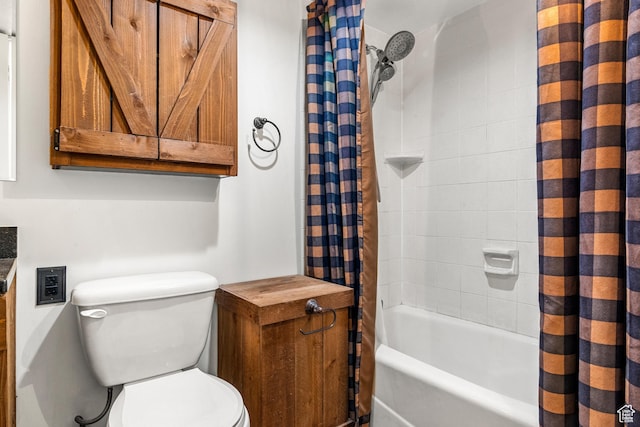 bathroom with shower / bath combo and toilet