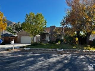 829 E 1925 N, North Ogden, UT 84414 - view of front of property with a garage and concrete driveway