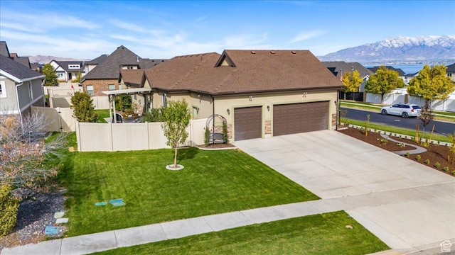 3879 S Mcgregor Ln, Saratoga Springs, UT 84045 - view of front facade with an attached garage, fence, driveway, a residential view, and a front lawn