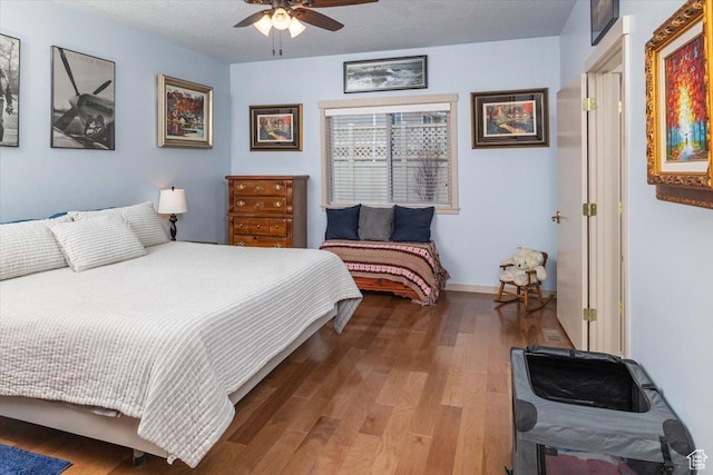 3879 S Mcgregor Ln, Saratoga Springs, UT 84045 - bedroom featuring a textured ceiling, ceiling fan, wood finished floors, and baseboards
