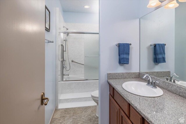 3879 S Mcgregor Ln, Saratoga Springs, UT 84045 - full bathroom with shower / bath combination with glass door, vanity, and toilet