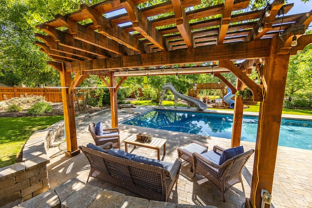 view of swimming pool with a fenced in pool, a patio, fence, a pergola, and a water slide