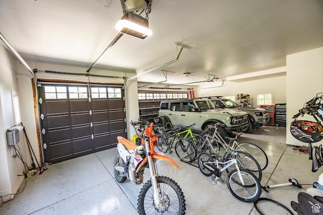 garage with bike storage and a garage door opener