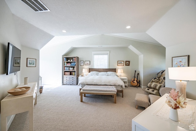 bedroom featuring lofted ceiling, visible vents, carpet, and recessed lighting