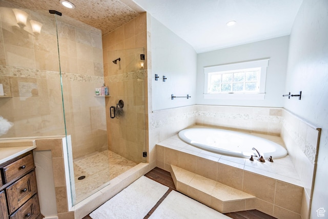 bathroom featuring a stall shower, recessed lighting, a bath, and tile patterned floors