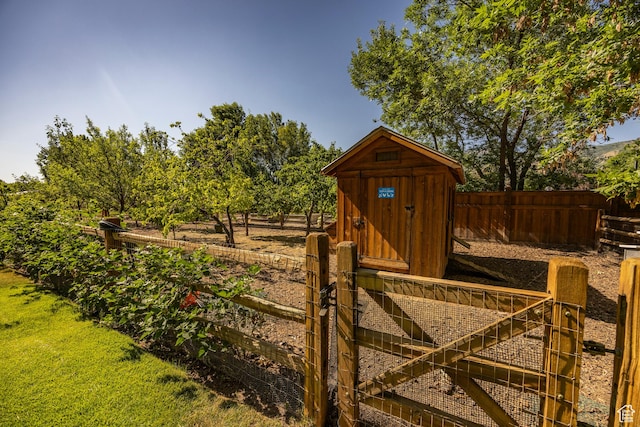 view of shed featuring fence