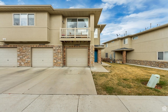 12793 S Timber Run Dr W, Riverton, UT 84096 - multi unit property with an attached garage, a balcony, driveway, stone siding, and stucco siding