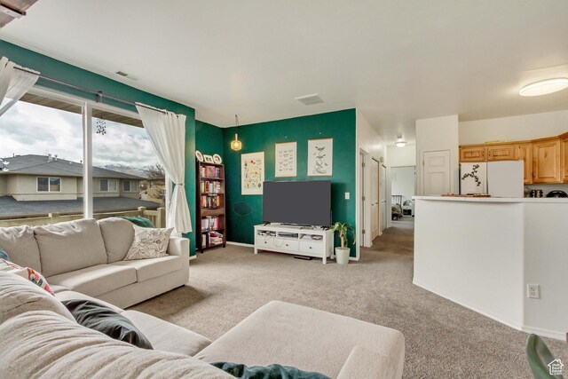 12793 S Timber Run Dr W, Riverton, UT 84096 - living room with visible vents, light carpet, and baseboards
