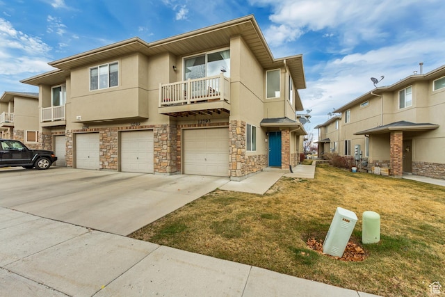 12793 S Timber Run Dr W, Riverton, UT 84096 - multi unit property featuring a garage, driveway, a front lawn, and stucco siding