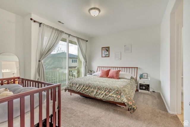 12793 S Timber Run Dr W, Riverton, UT 84096 - carpeted bedroom with access to exterior, arched walkways, visible vents, and baseboards