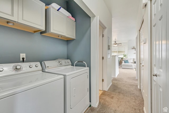12793 S Timber Run Dr W, Riverton, UT 84096 - laundry room with light colored carpet, cabinet space, baseboards, and separate washer and dryer
