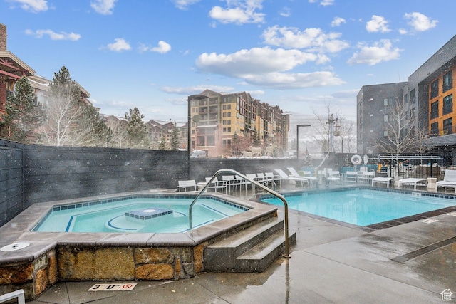 2670 W Canyons Resort Dr Unit 325, Park City, UT 84098 - pool with a community hot tub, a fenced backyard, and a patio