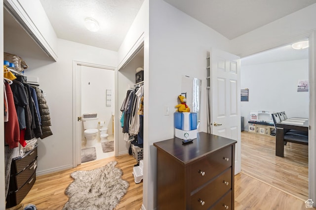 spacious closet with light wood-type flooring