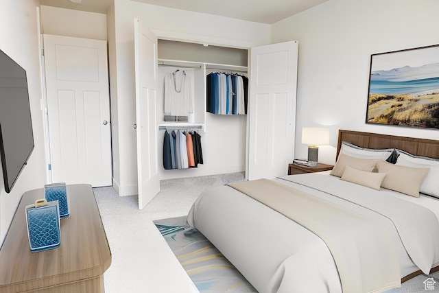 bedroom with a closet and baseboards